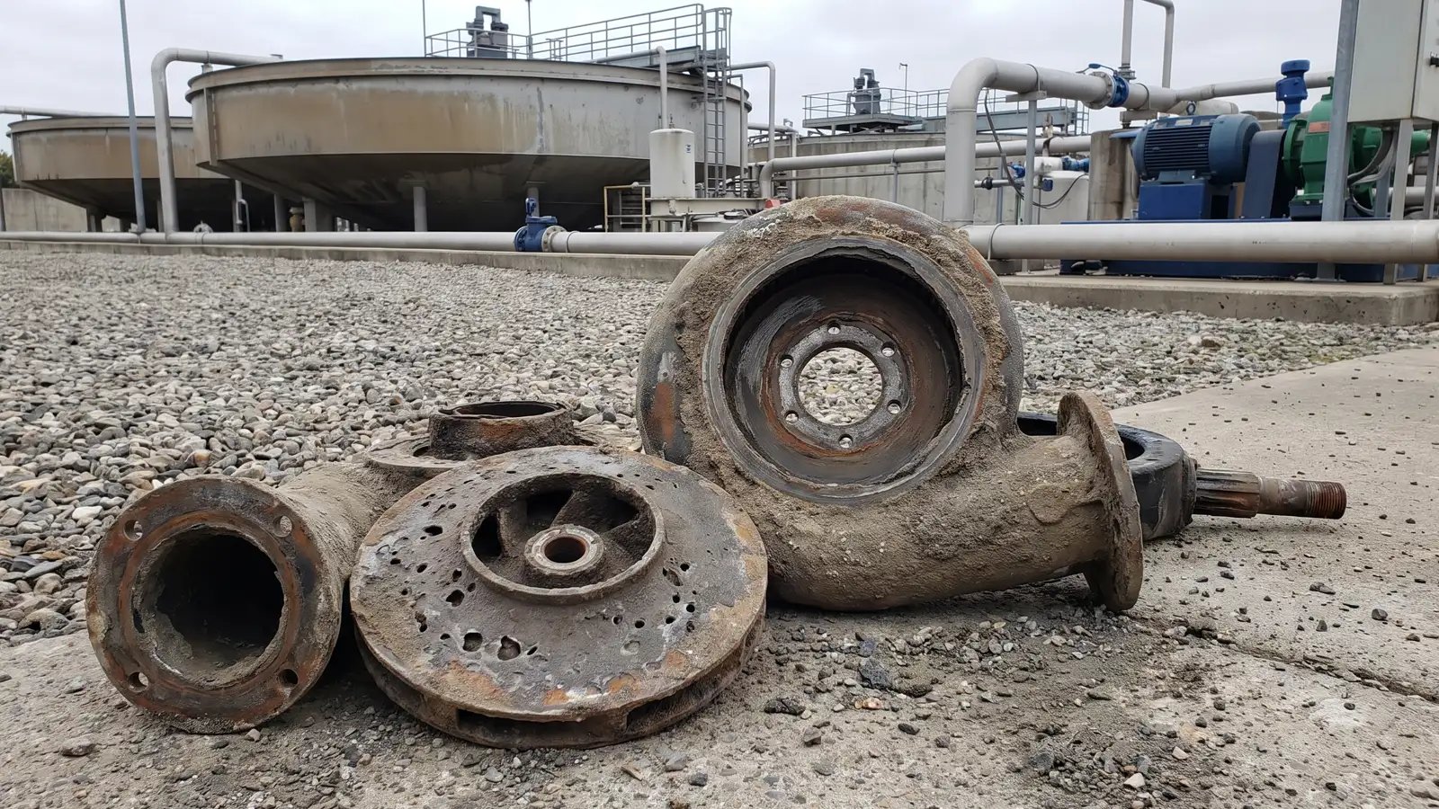 Severely worn industrial slurry pump casing and impeller after abrasive wastewater service at a treatment facility, showing erosion damage, reliable US pump replacement solutions, repair cost evaluation, and US manufactured pumping equipment for sale.